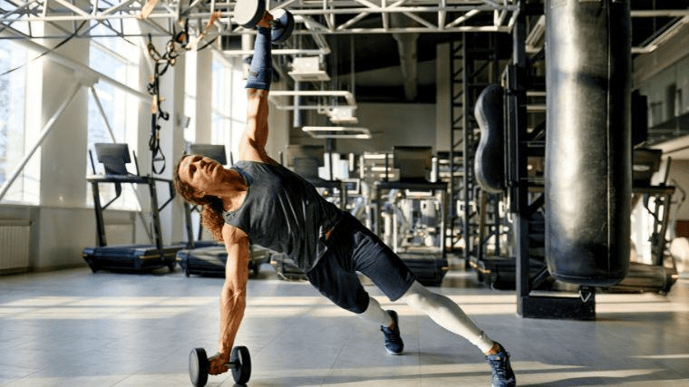 Single-arm dumbbell hold exercise for grip strength and core stability